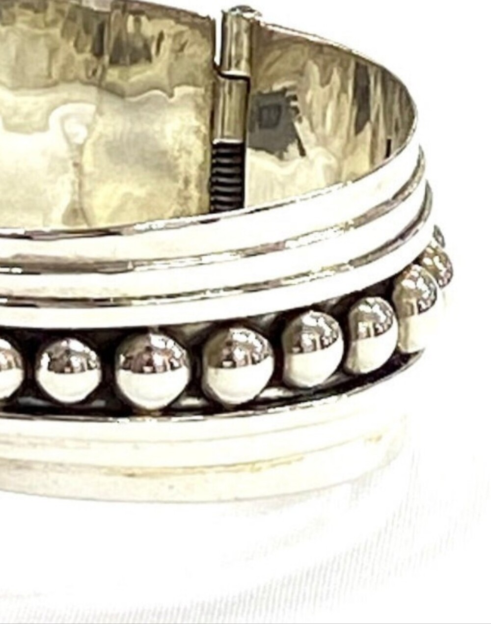 Sterling Silver Repoussé Ribbon Swirl Clamper Bracelet - Silver